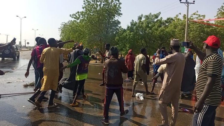 Youths washes roads in Dutse metropolis alleged dirty of Tinubu rally stain Jigawa